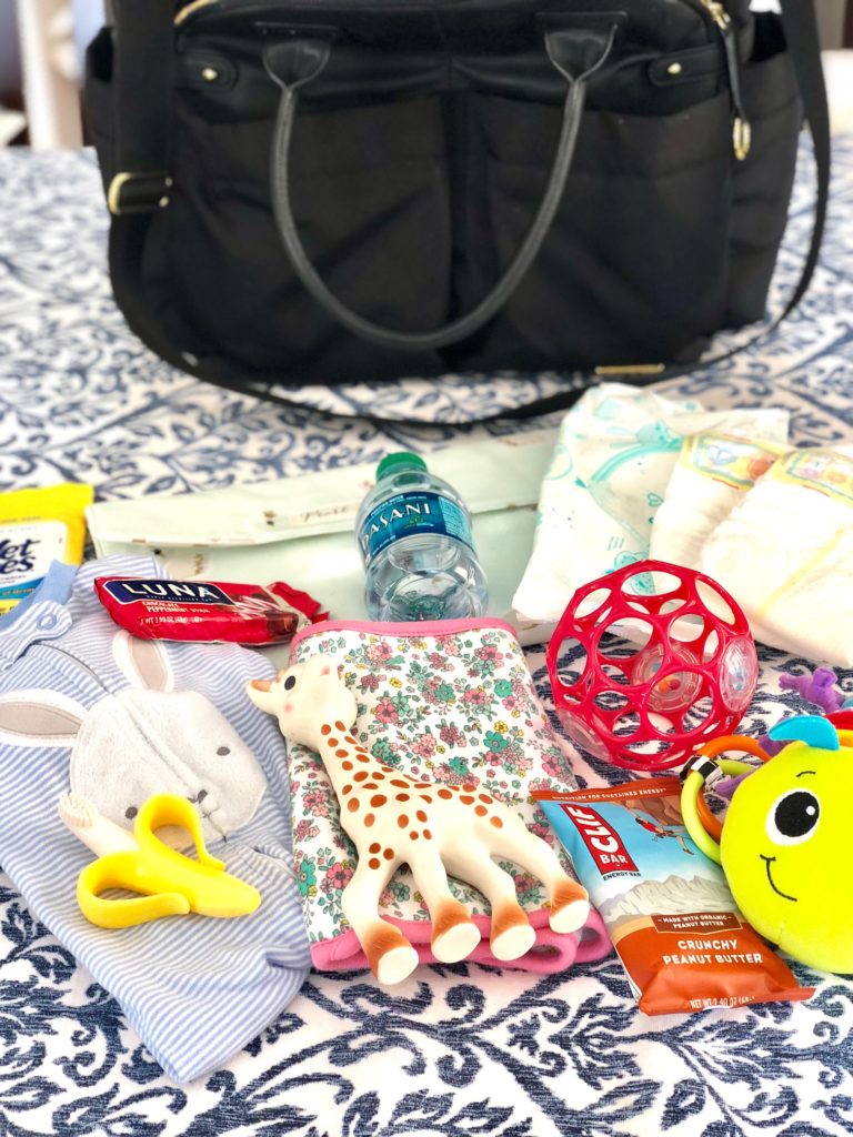 what to carry in your diaper bag for a 6 month old | Diaper Bag Essentials featured by popular Boston life and style blogger, Feathers and Stripes