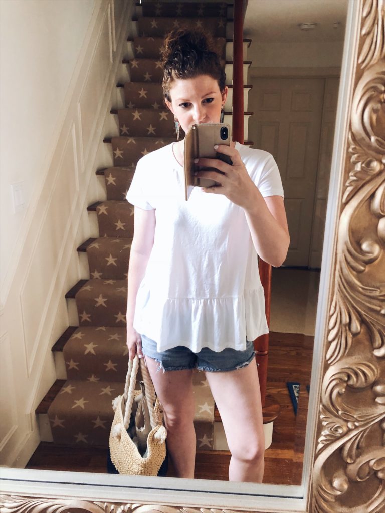 white peplum top and parrot earrings