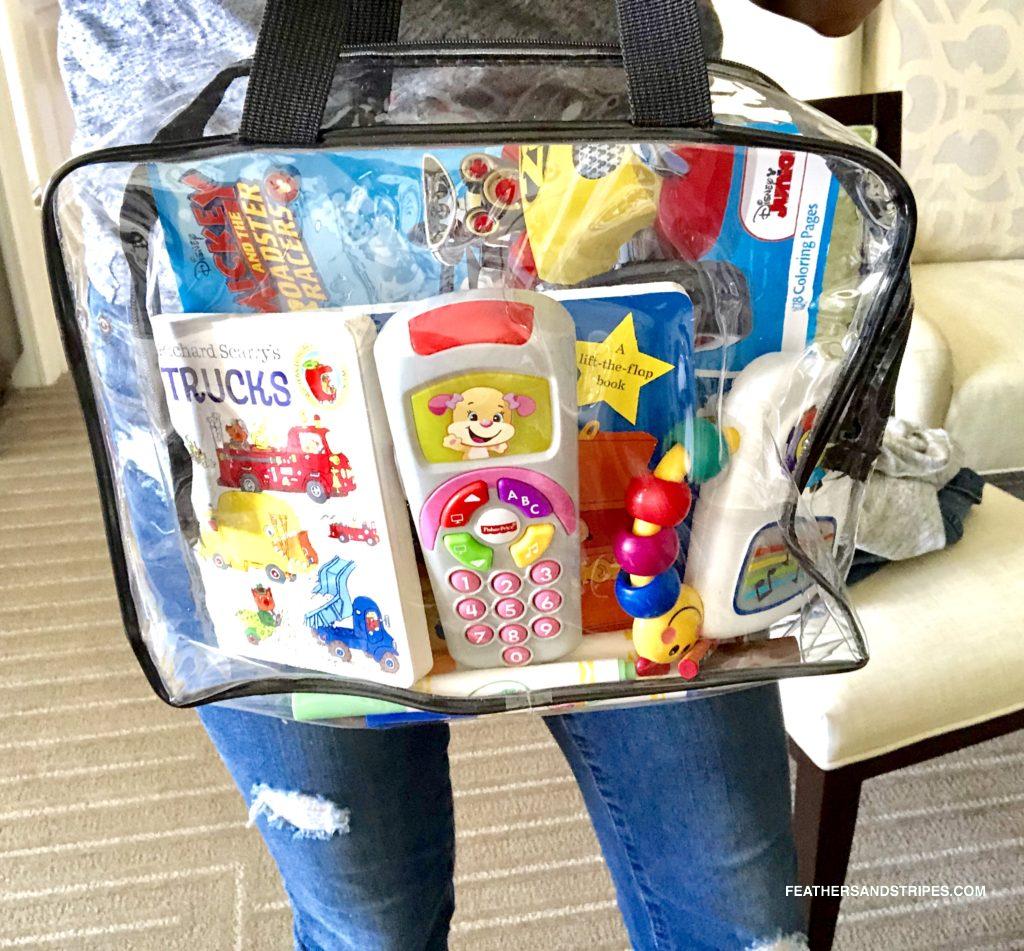 activity bag for traveling with a toddler - perfect for flying with a toddler! feathersandstripes.com