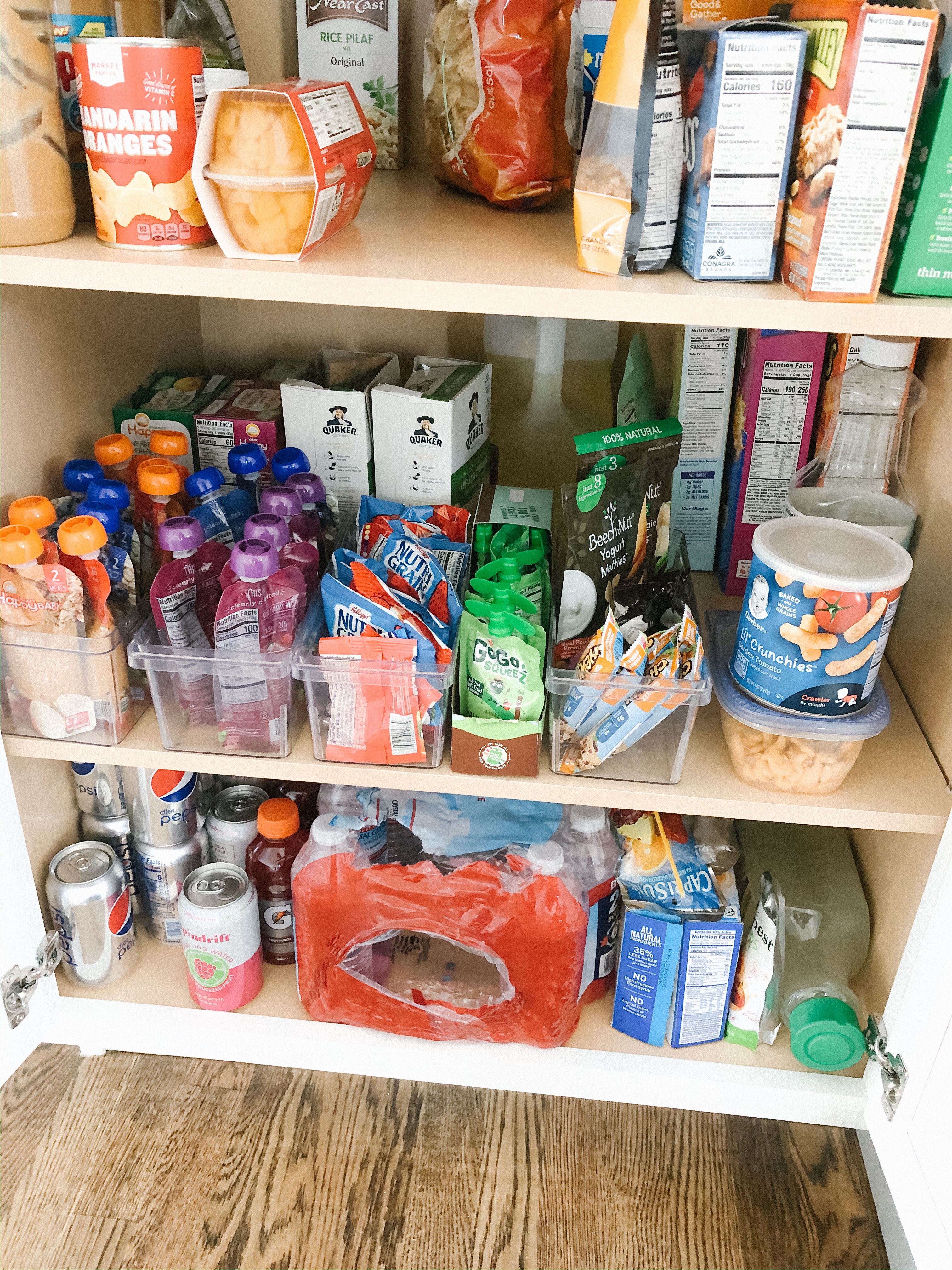 Snack cabinet all set up, with the toddler's snacks within their reach  (bottom shelf not pictured is surplus) : r/organization