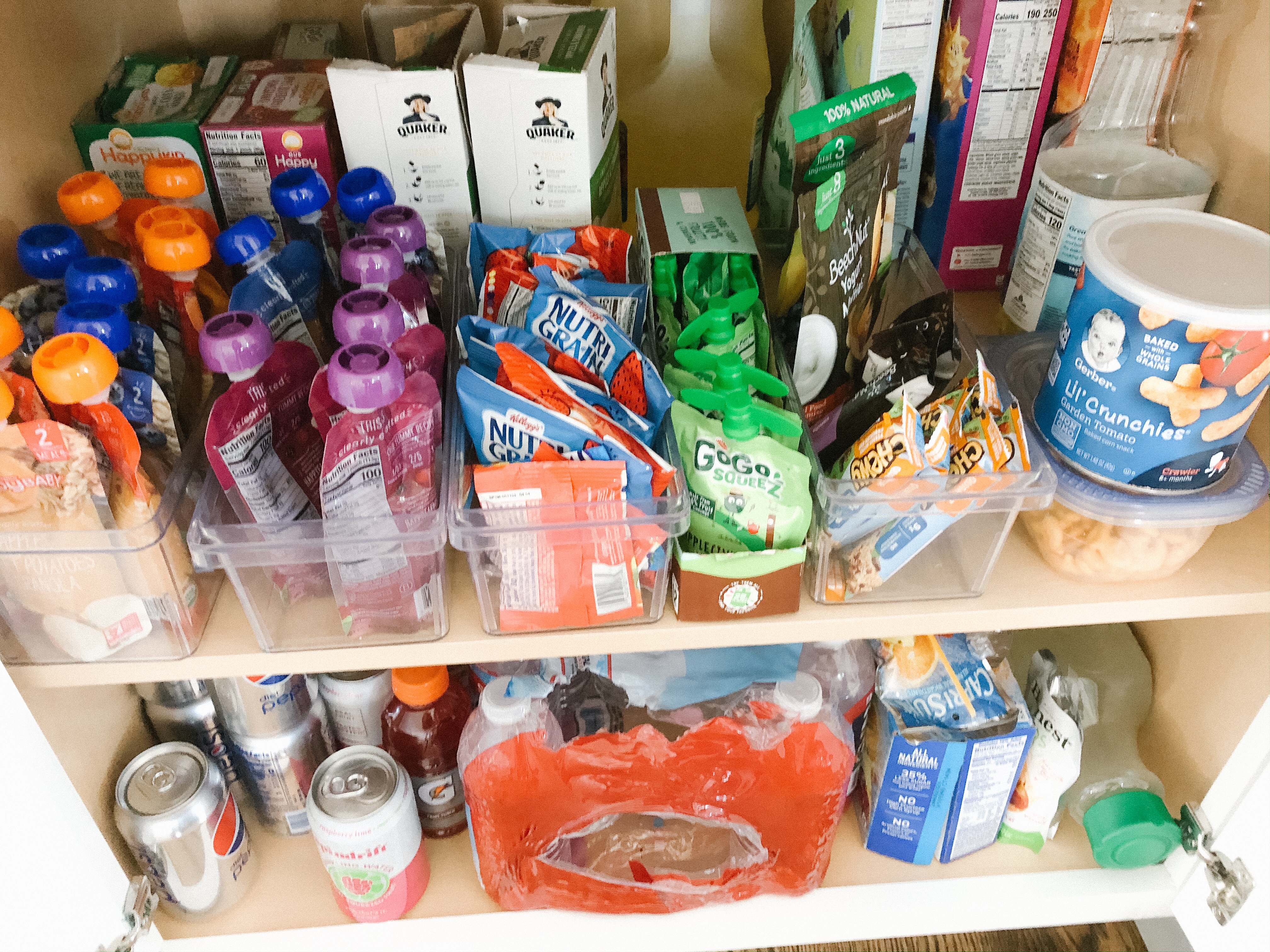 Snack cabinet all set up, with the toddler's snacks within their reach  (bottom shelf not pictured is surplus) : r/organization