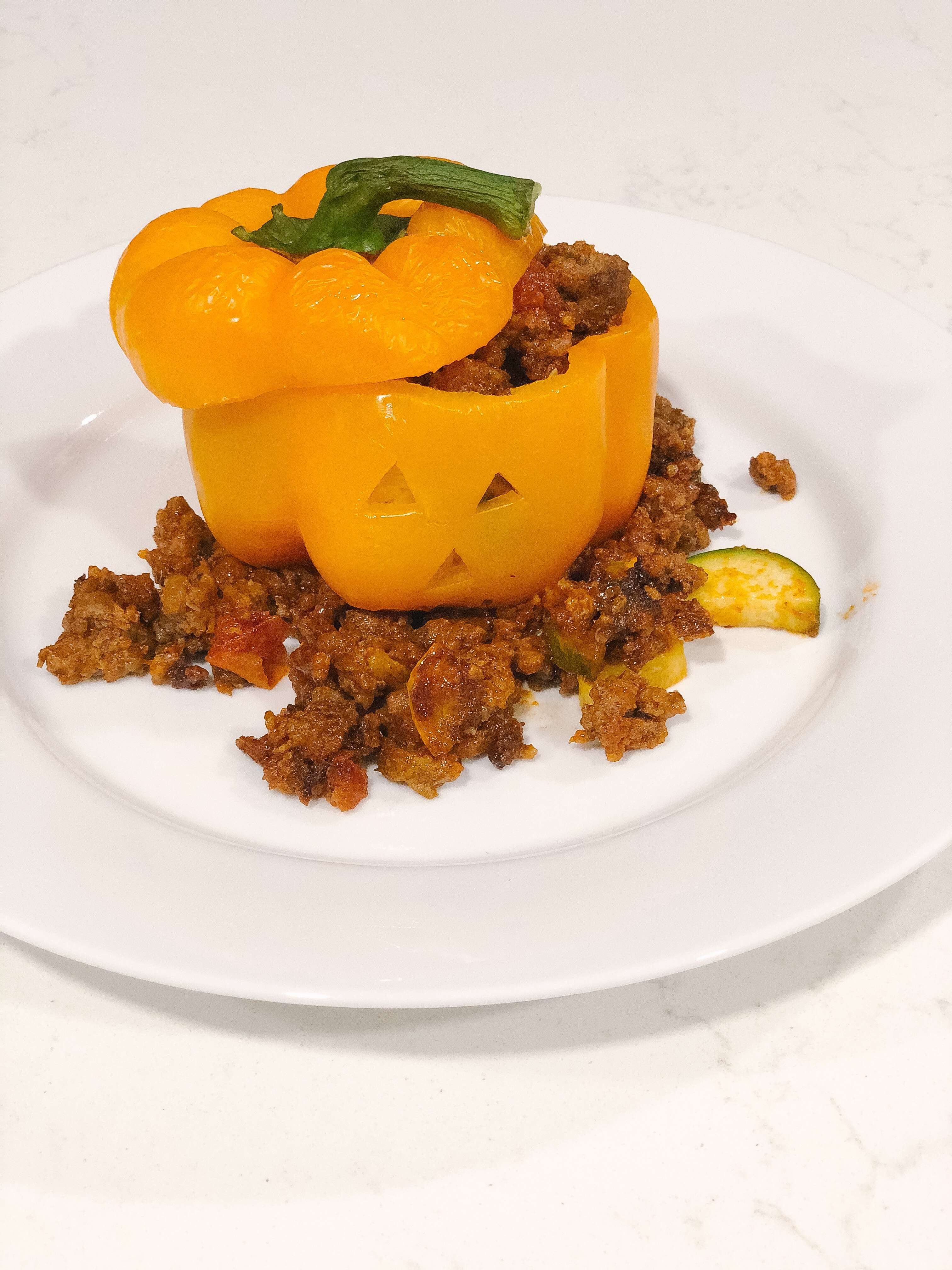 Jack-o-Lantern Stuffed Peppers on a plate